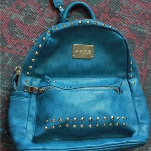 Bebe Jett Monogram Blue Studded Backpack
